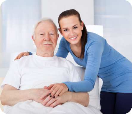an elderly man with a caregiver woman